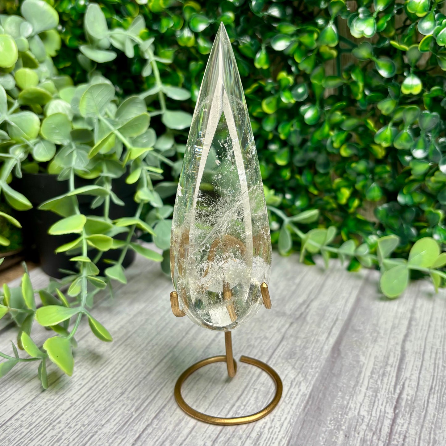CLEAR QUARTZ POINTS ON STANDS