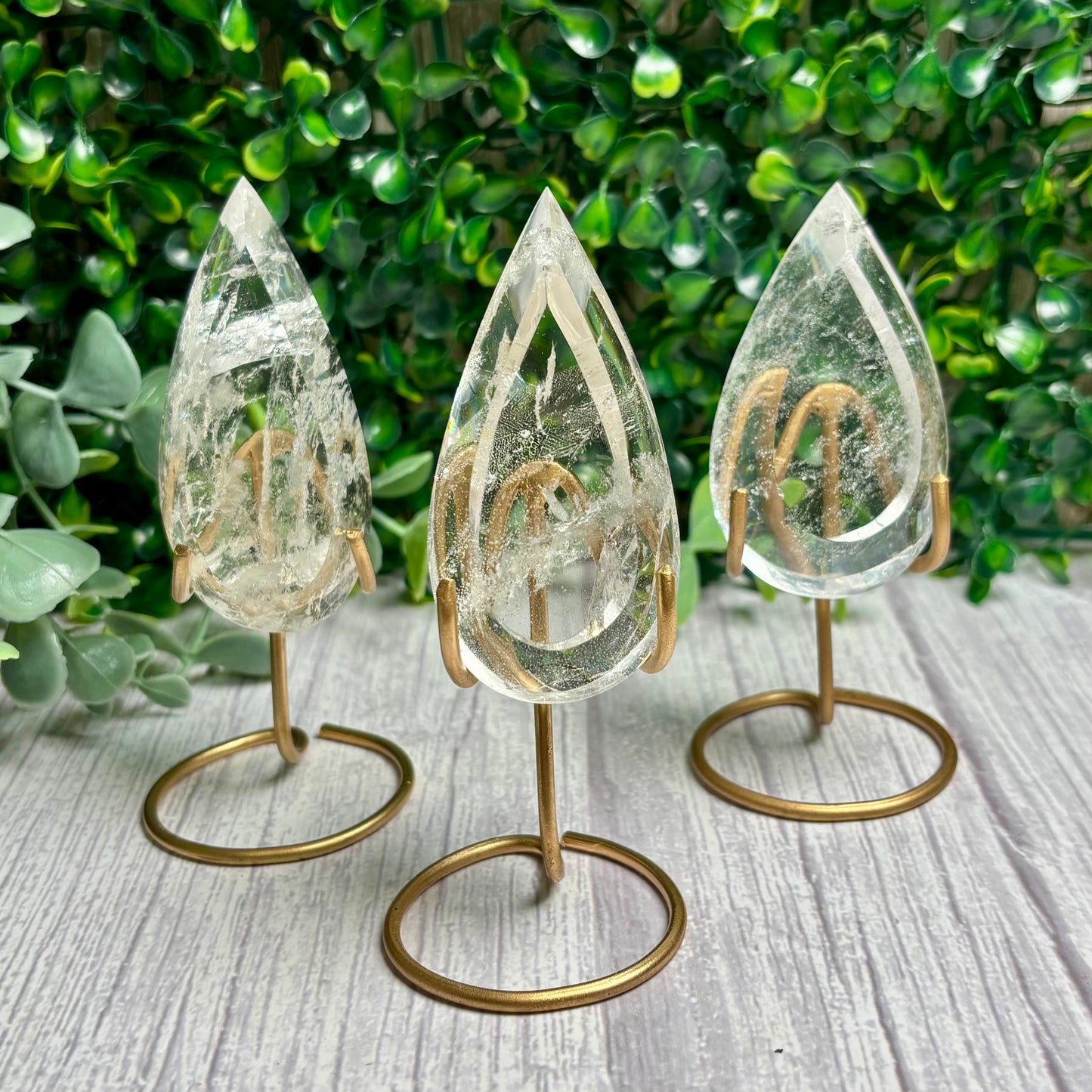 CLEAR QUARTZ POINTS ON STANDS